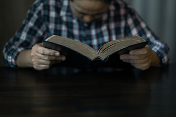 Christian congregation gathered at church, each hand holding Bible, Unwavering faith, prayer and...