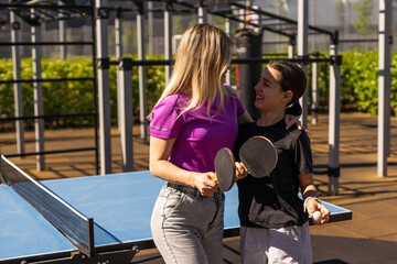 girl plays in table tennis outdoor