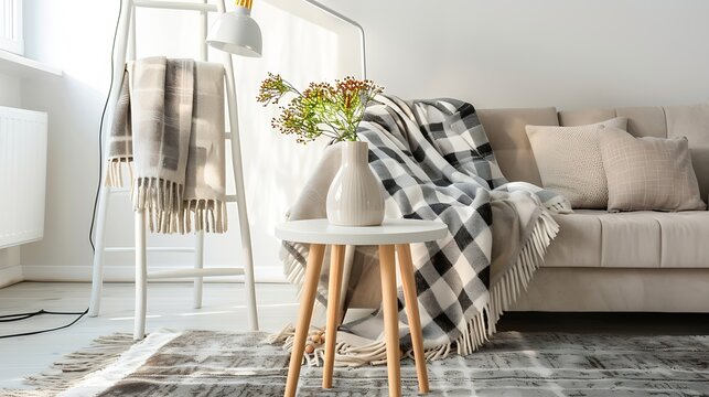 Blankets on a ladder and white table on a carpet in living room with lamp and cushions on a sofa : Generative AI