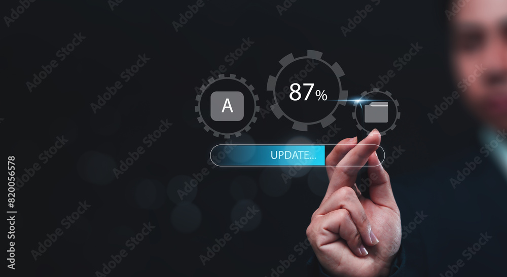 Fototapete Updating computer system software application installation for devices to be up to date with the new version. Hand interacting with graphics icon updating function screen loading on computer laptop.