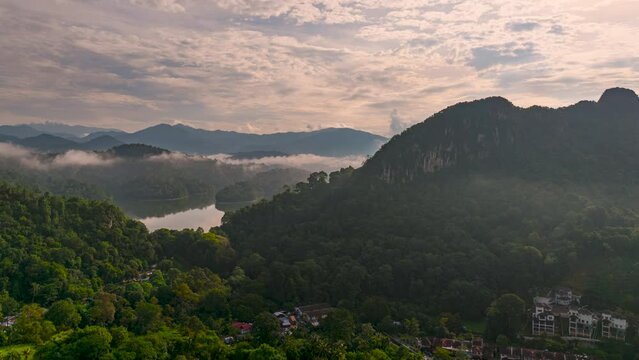 An aerial hyperlapse view peak of rocky hills Bukit tabur during morning.