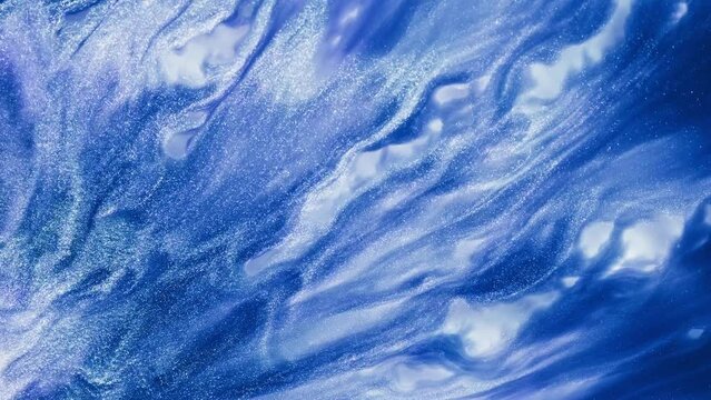 Fluid art drawing video, abstract acrylic texture with flowing effect. Liquid paint backdrop with chaotic waves and swirls. Artistic background motion with glitter and blue overflowing colors.