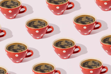 Black coffee in ceramic cup, cute retro style, pattern on pastel pink background.