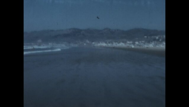 Driving on Pismo Beach 1972 - Dune buggies and motorcycles drive on Pismo Beach, California in 1972, before the Ocean Dunes State Vehicular Recreation Area was created in 1974. 