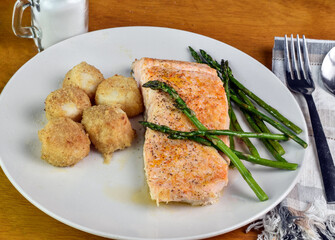 seasoned baked salmon  with asparagus and scallops