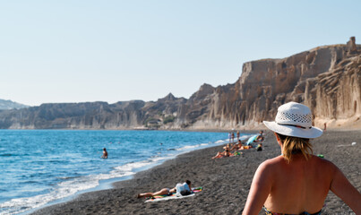 Tourist on Vlichada Beach, Santorini, Greece