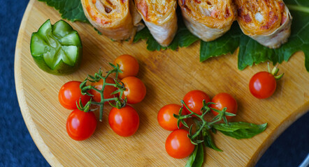 small tomatoes and lavash on the board