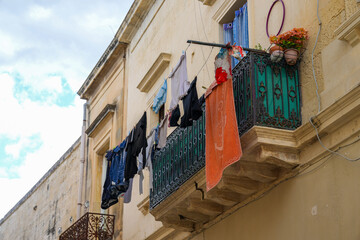 Colorful Laundry drying in the the golden historic center of Lecce Italy