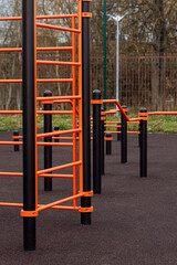 Modern sports field with horizontal bars in the park. Street workout. High quality photo