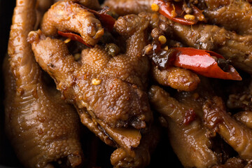 Close up view of Chinese food spicy chicken claws