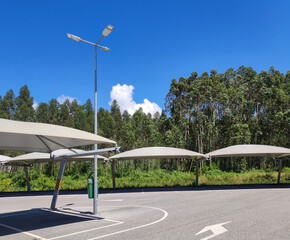 Empty parking lot near a supermarket with LED lights and modern canopies in central Portugal