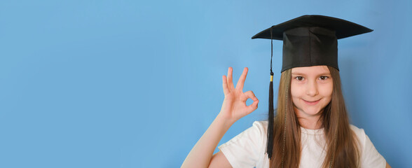Banner. Sweet, smart, cheerful, cheerful, confident student-scientist girl with graduation hat on...