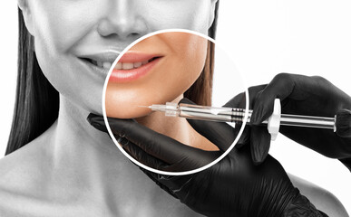 Cosmetologist does injections for lips augmentation and anti wrinkle in the nasolabial folds of a...