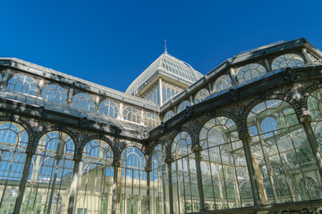 Photograph of the Crystal Palace in El Retiro park. Architecture. City of Madrid. Green area....