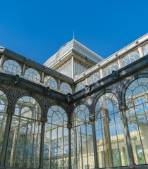 Photograph of the Crystal Palace in El Retiro park. Architecture. City of Madrid. Green area. European tour