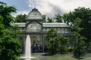 Fototapeta premium Photograph of the Crystal Palace in El Retiro park. Architecture. City of Madrid. Green area. European tour