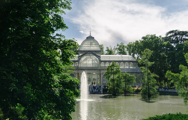Photograph of the Crystal Palace in El Retiro park. Architecture. City of Madrid. Green area. European tour