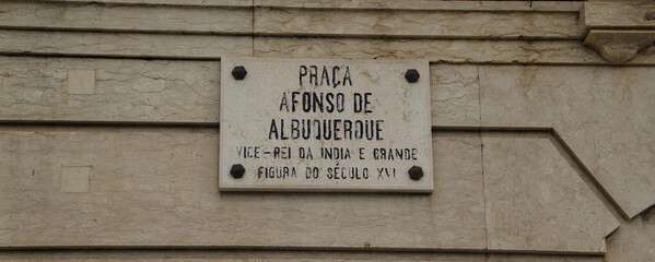 Plaque of the Plaza de Alfonso de Alburqueque placed on a wall in Lisbon