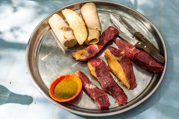 Ethiopia, raw meat cubes is a typical meal in South Ethiopia.