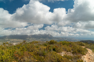 Beautiful landscape with mountains, cloudy blue sky. 