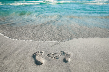 beautiful footprints in the sand near the sea on nature background