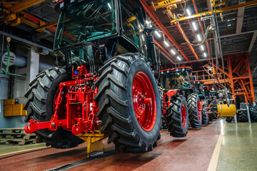 Tractor industry manufacture. New tractors on factory line. Production of agricultural machinery © uladzimirzuyeu