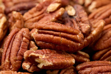 Organic Pecan Nuts top view background, texture. Healthy food