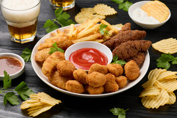 Chicken nuggets, Southern strips, Chicken fingers, french fries, chips, various sauces and beer
