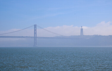 Amazing suspension bridge, Ponte 25 de Abril, Sanctuary of Christ the King, Catholic statue dedicated to the Sacred Heart of Jesus, inspired by Christ the Redeemer of Rio de Janeiro, Lisbon, Portugal.