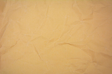 Beige color background with little wrinkles. Beige color recycled craft paper texture as background.