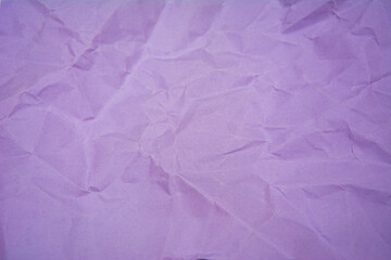 Purple color background with little wrinkles. Purple recycled craft paper texture as background.