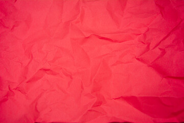 Fototapeta premium Red color background with little wrinkles. Red recycled craft paper texture as background.