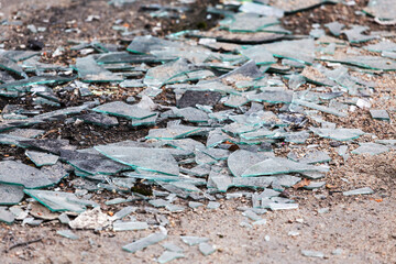 shards of broken glass on the ground. accident, earthquake.