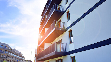 Fototapeta premium New contemporary residential construction architecture background. Modern house facade exterior.