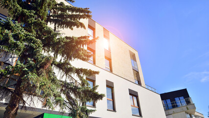 Eco-friendly living in city with greens. Eco apartment building saving energy and fresh air concept. 