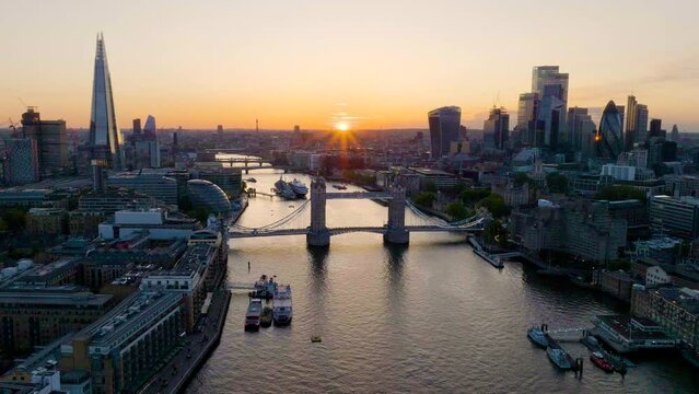 Aerial drone panoramic view revealing famous London cityscape over River Thames.