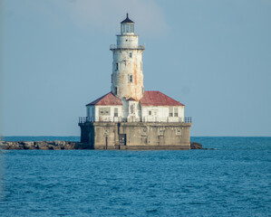 Small lighthouse on a building by the water