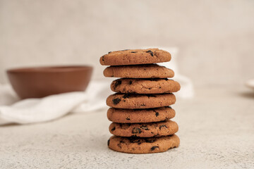 Sweet cookies with chocolate chips on white background