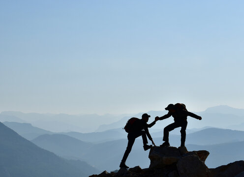 Joy of Teammates after a Difficult Climb	