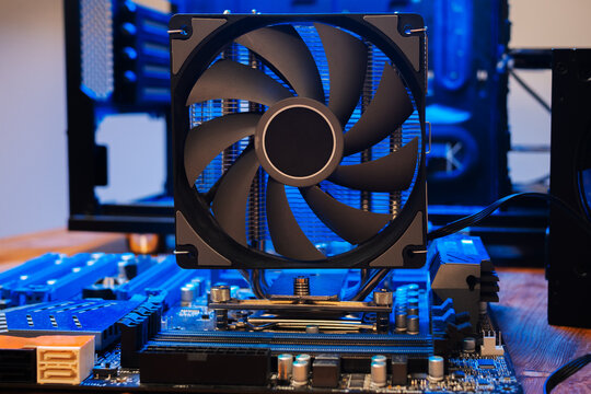 Modern computer parts with PC case on background. Building personal gaming and workstation pc concept. hardware components and system unit. 