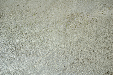 Selective focus, textured background image of fresh mixed cement in construction