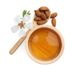 Almond oil in bowl, flower and spoon with nuts isolated on white, top view
