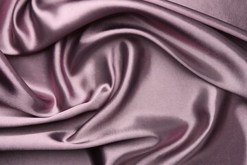 Obraz premium Crumpled dark purple silk fabric as background, top view