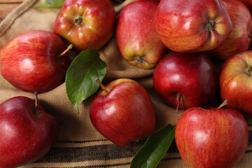 Fresh ripe red apples on table, closeup
