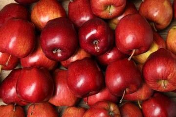 Fresh ripe red apples as background, top view