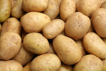 Fresh raw potatoes as background, top view