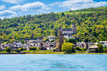 View over Oberwesel am Rhein town in Rhine Valley, Germany. Oberwesel medieval towers and St. Martin church seen from river in Rhineland-Palatinate