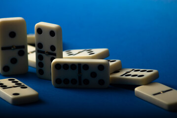 Dominoes with blue background, copy space and various angles.