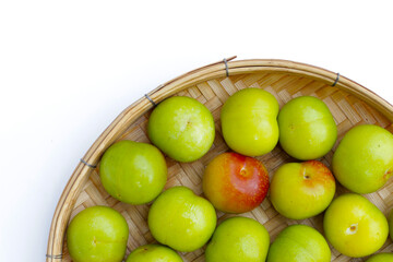 Fresh green plum fruit on white background.