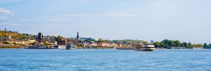 Panorama of Rudesheim am Rhein town on Rhine river near Bingen, Germany. Waterfront with cruise ships. Rhine valley is popular tourist destination for river cruise and short vacation